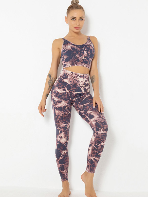 Printed women's sports bra and leggings set for yoga, featuring breathable nylon material, designed for comfort and style.